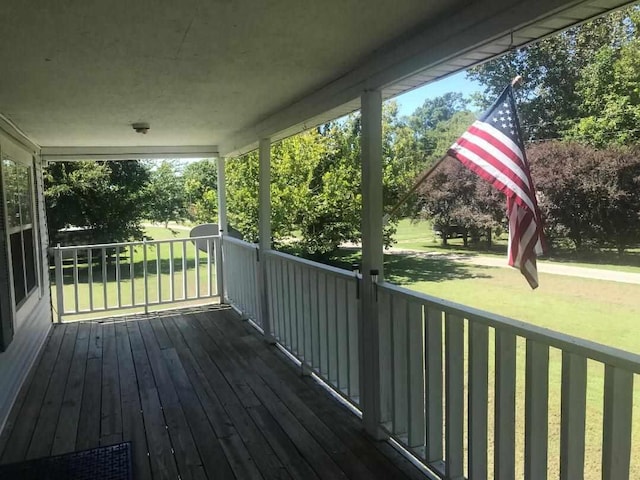 deck featuring a lawn