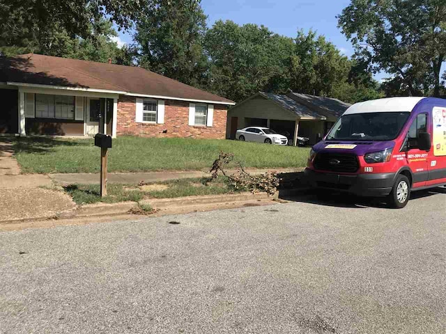 single story home with a front lawn