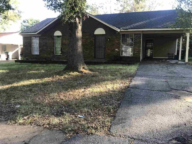 single story home with a carport and a front lawn