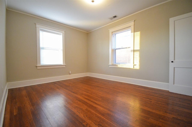 unfurnished room with crown molding and dark hardwood / wood-style floors