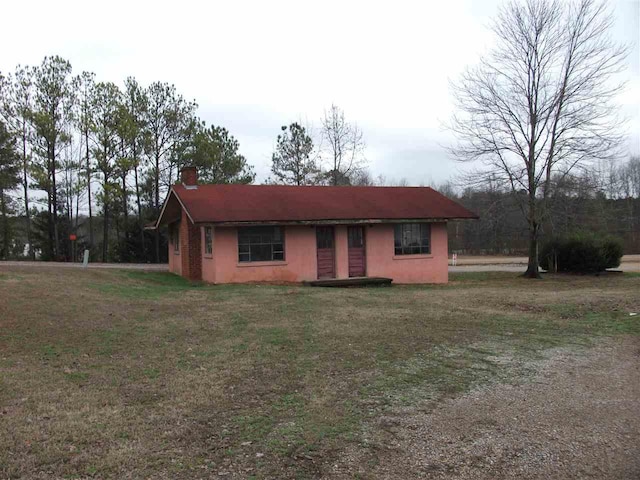 exterior space with a yard