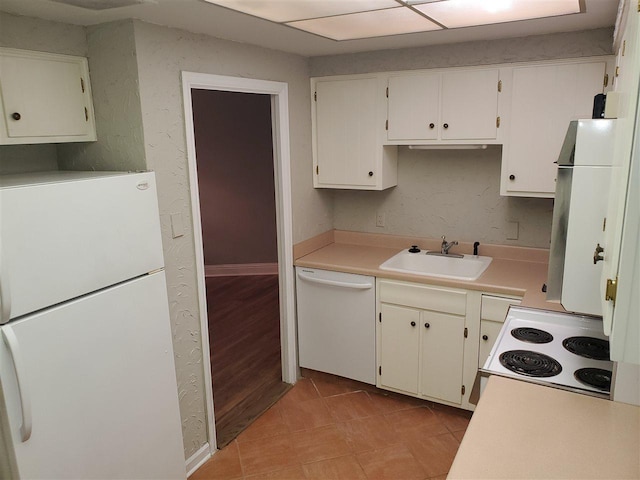 475 N Highland Avenue 3h, Memphis, TN 38122 - kitchen with sink, white appliances, light tile floors, and white cabinets