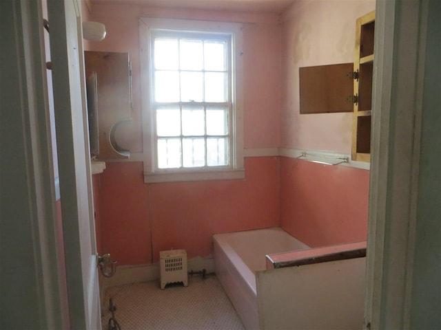 bathroom with a bath to relax in