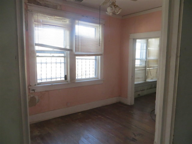 unfurnished room featuring dark hardwood / wood-style flooring and ceiling fan