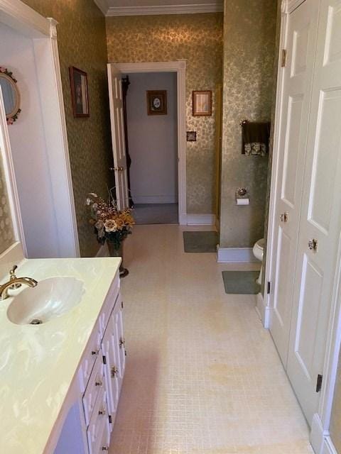 bathroom with vanity, tile flooring, toilet, and ornamental molding