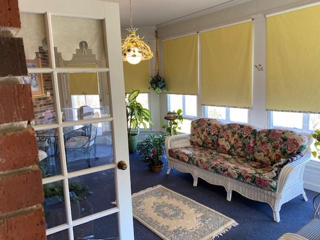 sunroom featuring french doors