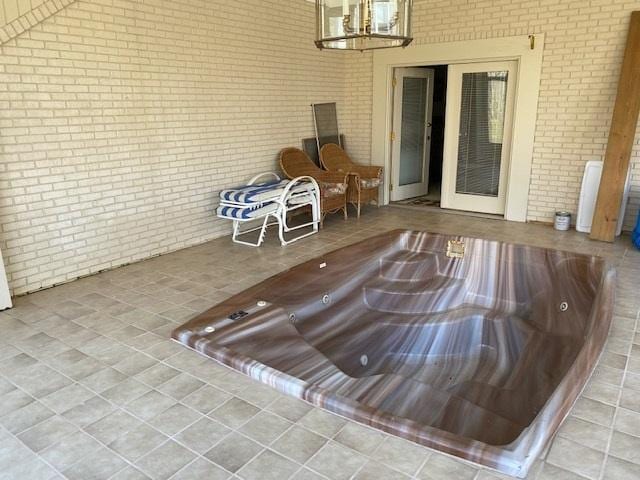 entry to storm shelter featuring a patio area