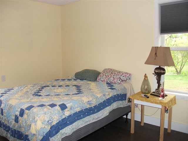 bedroom featuring dark hardwood / wood-style flooring