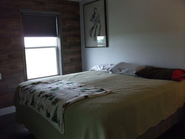 bedroom with wooden walls