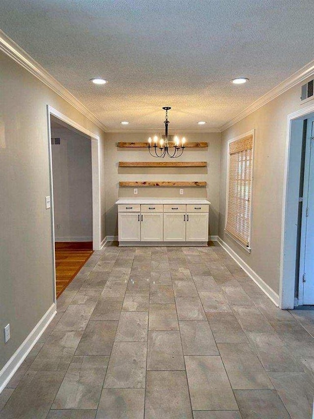 interior space with light tile flooring, crown molding, and an inviting chandelier