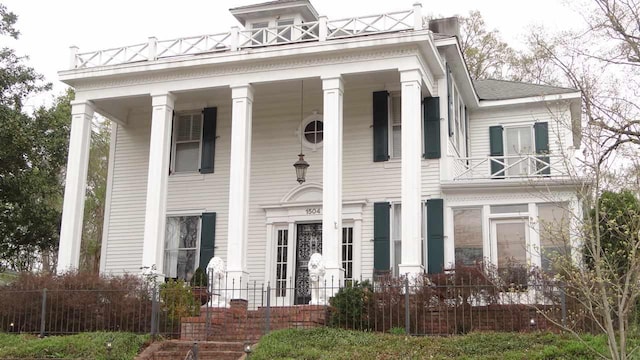 greek revival house featuring a porch