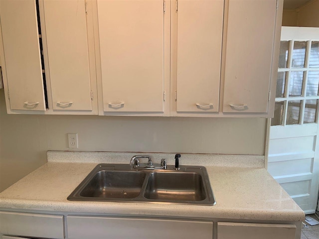 kitchen with white cabinets and sink