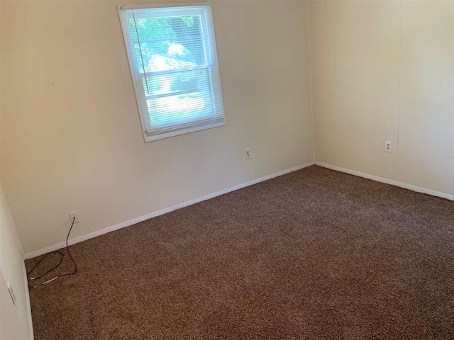 unfurnished room with carpet floors