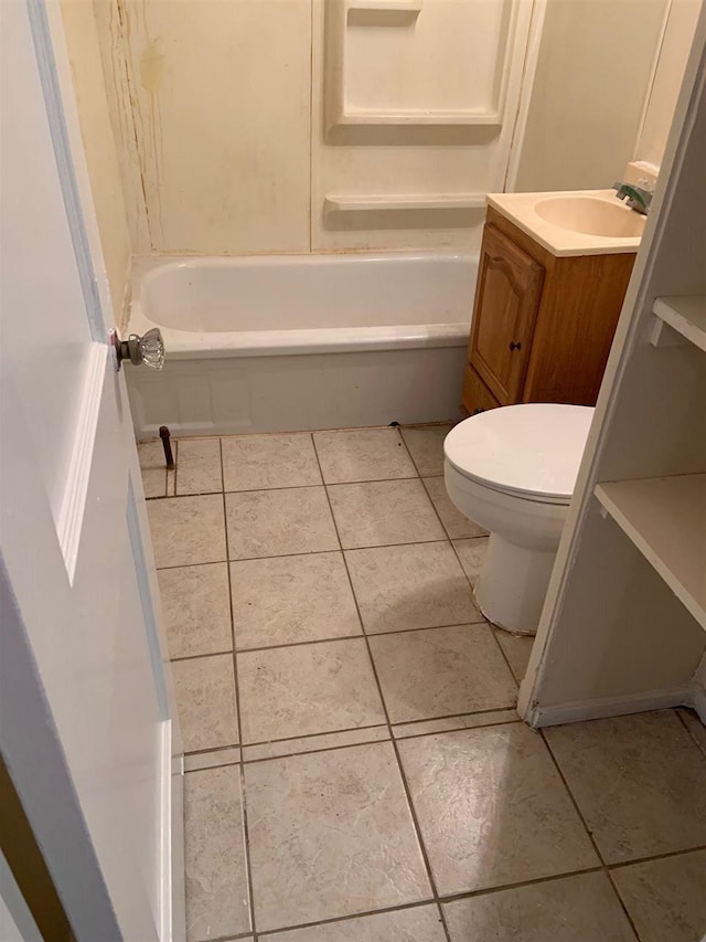 bathroom with vanity, tile flooring, and toilet