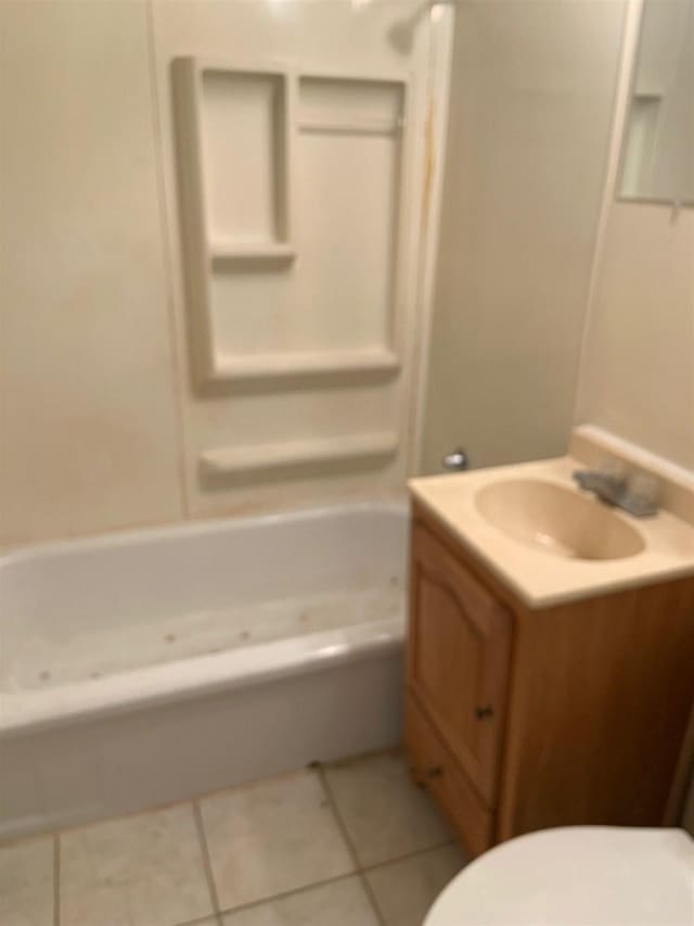 full bathroom with shower / tub combination, toilet, tile floors, and vanity