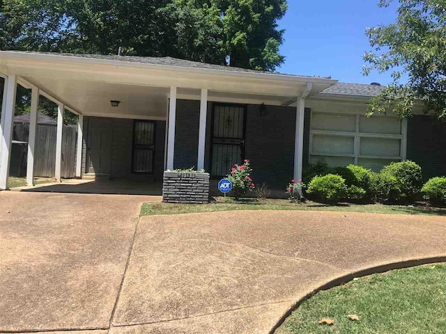 view of front of property with a carport