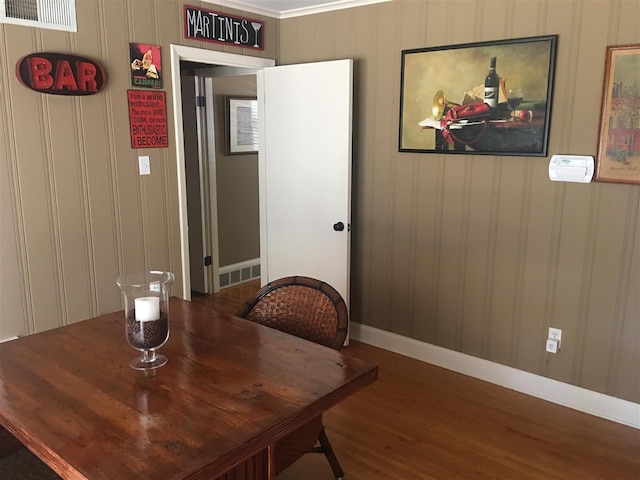 dining space with dark hardwood / wood-style flooring