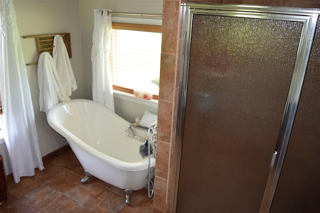 bathroom with tile floors and independent shower and bath