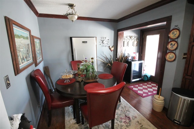 180 Holly Grove Road, Covington, TN 38019 - dining area featuring dark hardwood / wood-style floors and crown molding