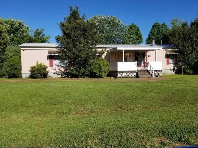 rear view of house with a lawn