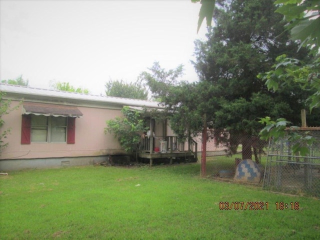 view of yard featuring a deck