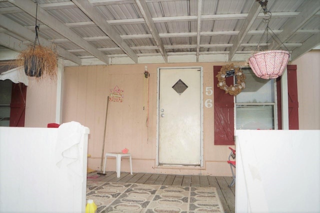 doorway to property featuring ceiling fan