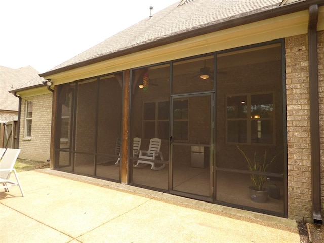 exterior space featuring a sunroom and a patio