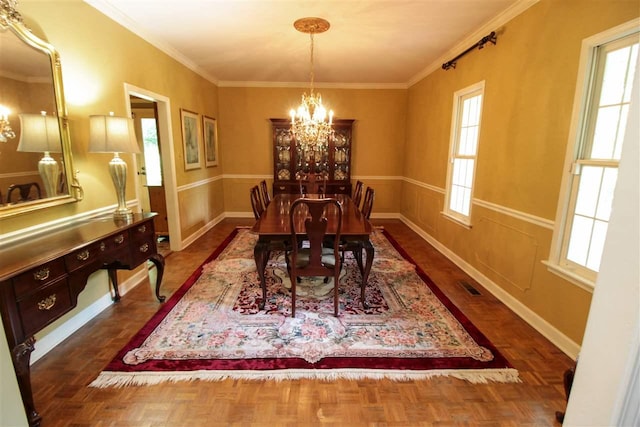 9351 Rocky Valley Cv, Memphis, TN 38018 - dining area with dark parquet flooring, a wealth of natural light, and a chandelier