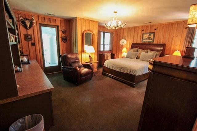 9351 Rocky Valley Cv, Memphis, TN 38018 - carpeted bedroom with an inviting chandelier and wooden walls