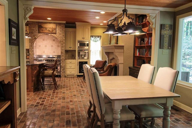 9351 Rocky Valley Cv, Memphis, TN 38018 - dining space with wine cooler, a notable chandelier, wood ceiling, and crown molding
