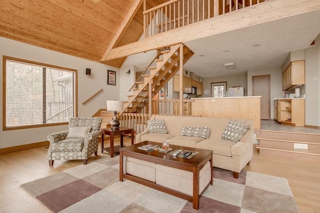 living room with wood ceiling, high vaulted ceiling, and light wood-type flooring