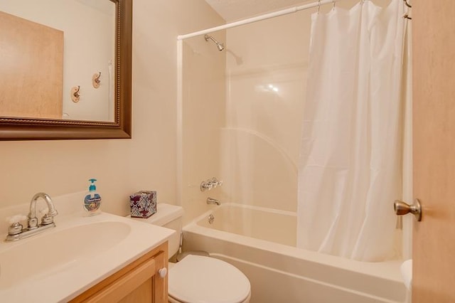 full bathroom featuring vanity, shower / bath combo, and toilet