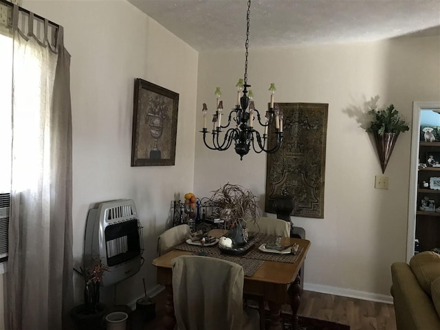 dining area featuring an inviting chandelier and dark wood-type flooring