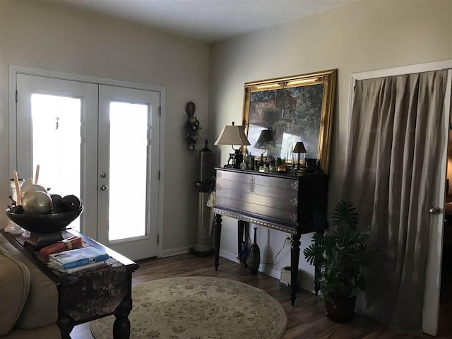 entryway featuring dark wood-type flooring and french doors