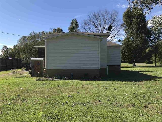 view of property exterior featuring a yard