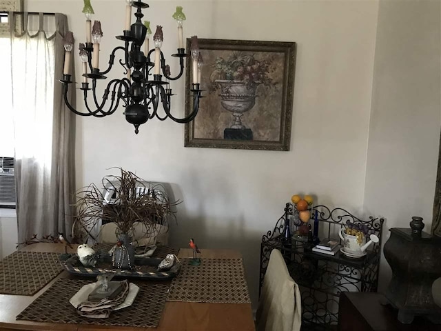 dining area with an inviting chandelier