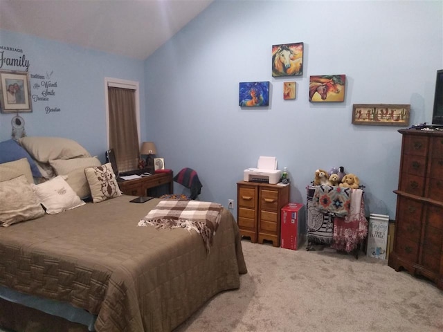 carpeted bedroom featuring lofted ceiling