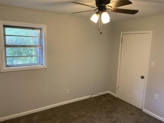 carpeted empty room featuring ceiling fan