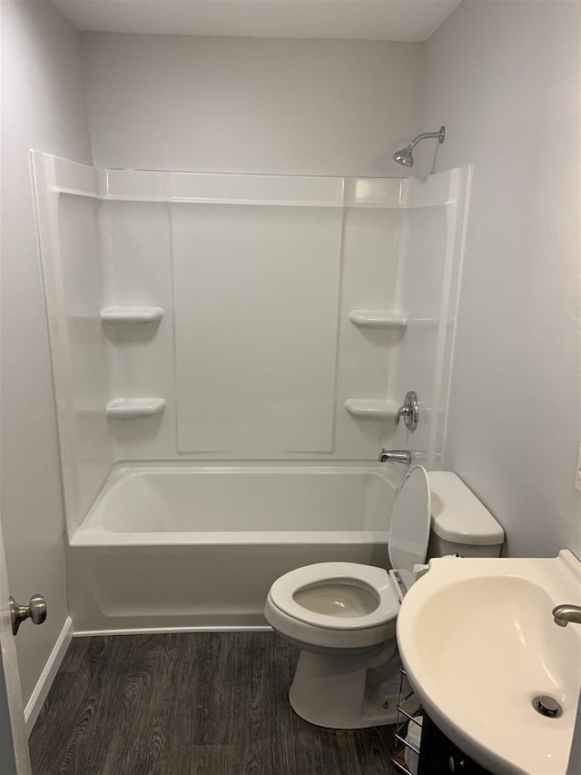 full bathroom featuring shower / bathtub combination, toilet, wood-type flooring, and sink