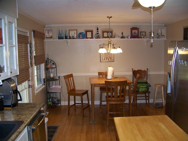 155 Eunice Lane, Savannah, TN 38372 - dining area with dark wood-type flooring and ceiling fan with notable chandelier