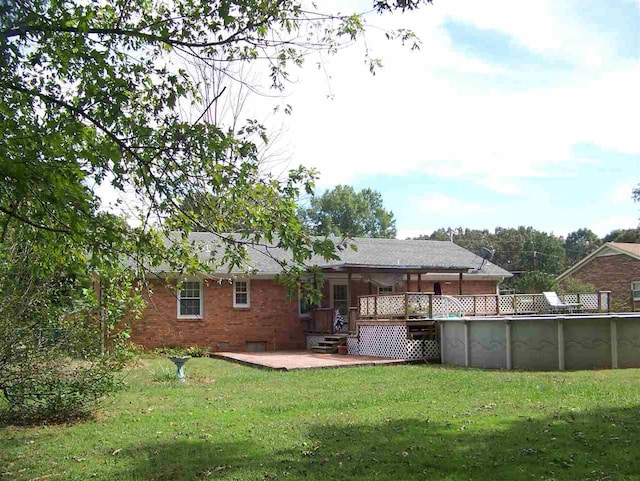 155 Eunice Lane, Savannah, TN 38372 - back of house with a yard and a swimming pool side deck