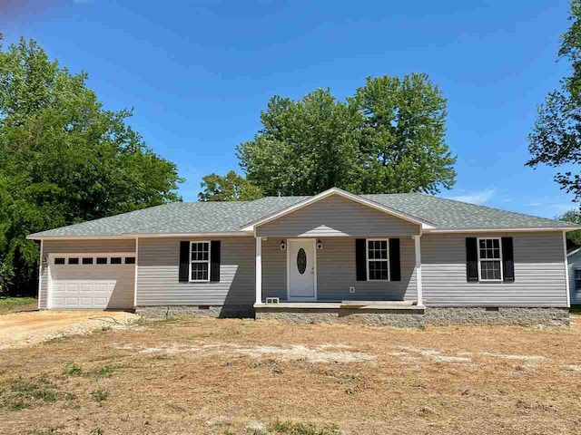 ranch-style house with covered porch and a garage