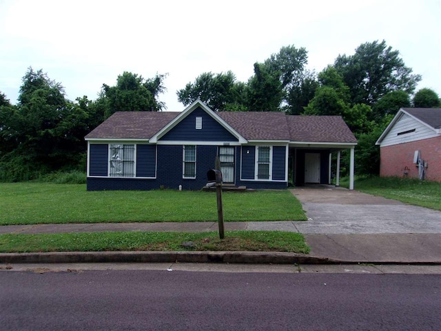 ranch-style home with a carport and a front lawn