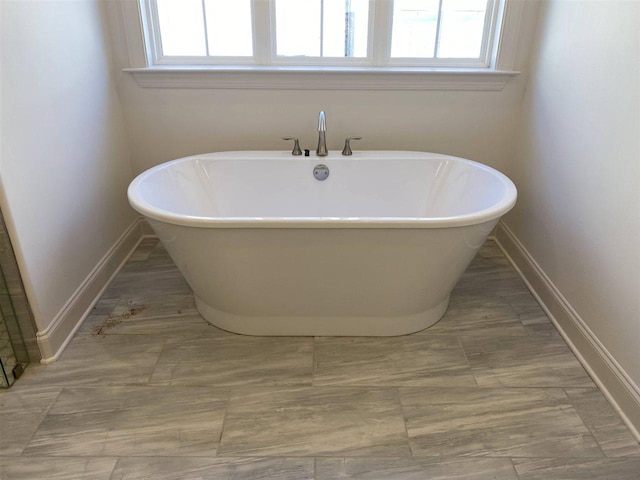 bathroom featuring a wealth of natural light and tile floors