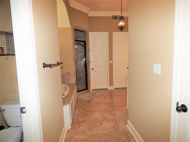 bathroom with toilet, ornamental molding, tile floors, and plus walk in shower