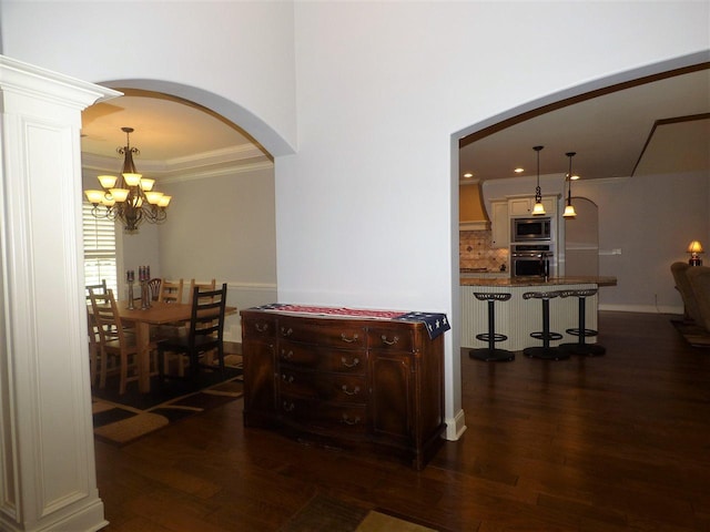 corridor featuring a chandelier and dark hardwood / wood-style flooring