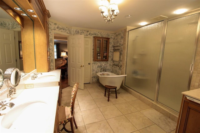 9351 Rocky Valley Cv, Memphis, TN 38018 - bathroom featuring an inviting chandelier, oversized vanity, shower with separate bathtub, ornamental molding, and tile floors