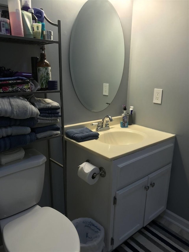 bathroom with toilet and vanity