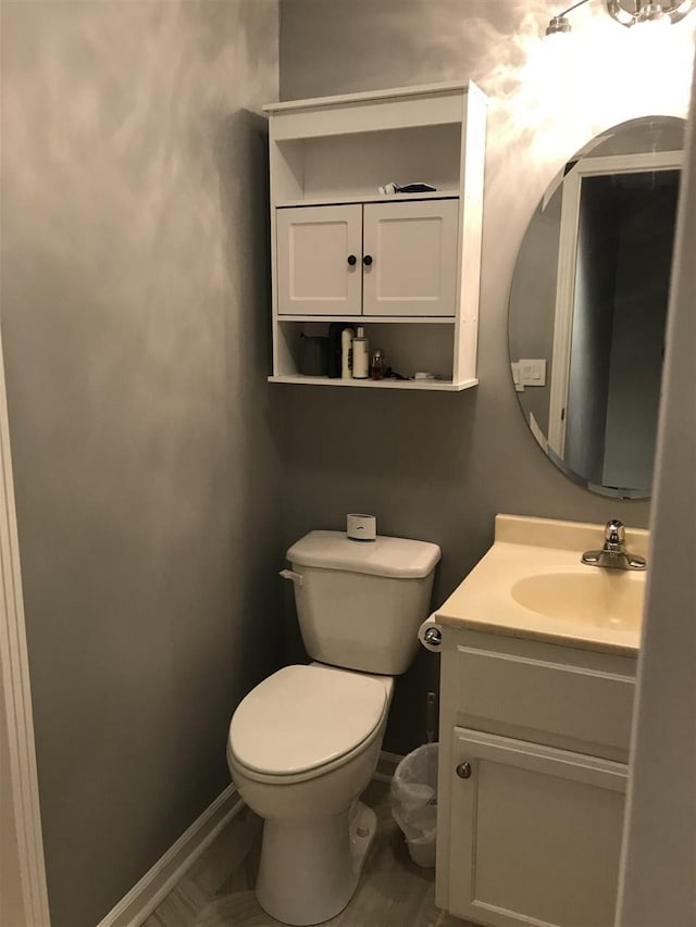 bathroom with toilet and vanity