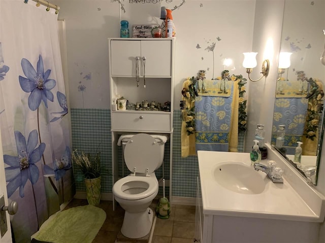 bathroom with oversized vanity, tile flooring, and toilet